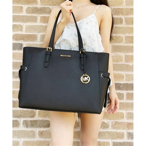 zip top michael kors tote|largest michael kors tote.